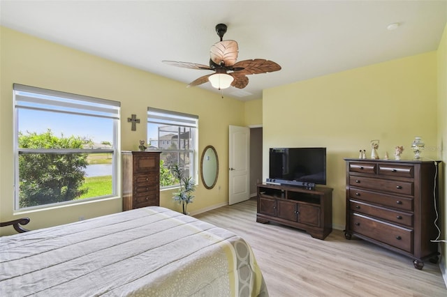2941 Marlberry Ln, Clermont, FL 34714 - bedroom featuring multiple windows, light wood-style floors, and ceiling fan