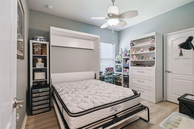 2941 Marlberry Ln, Clermont, FL 34714 - bedroom with light wood-style flooring and ceiling fan