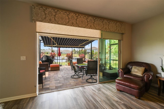 2941 Marlberry Ln, Clermont, FL 34714 - doorway to outside featuring wood finished floors and baseboards