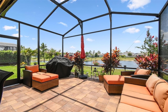 2941 Marlberry Ln, Clermont, FL 34714 - view of patio with glass enclosure, a grill, and a water view