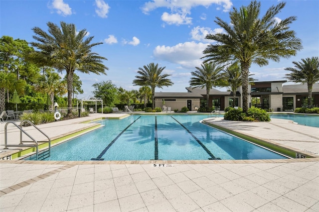 2941 Marlberry Ln, Clermont, FL 34714 - community pool with a patio area