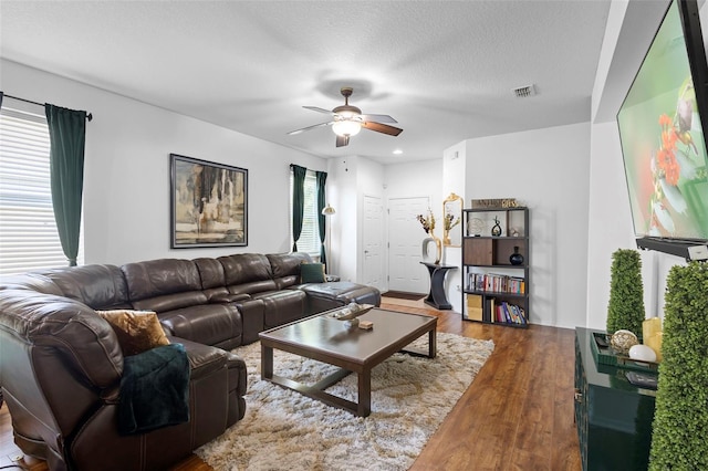 30245 Cheval St, Mount Dora, FL 32757 - living room featuring wood finished floors, ceiling fan, and a textured ceiling