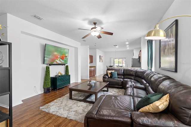 30245 Cheval St, Mount Dora, FL 32757 - living room featuring wood finished floors, a ceiling fan, and baseboards