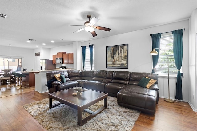 30245 Cheval St, Mount Dora, FL 32757 - living area with a ceiling fan, hardwood / wood-style flooring, plenty of natural light, recessed lighting, and a textured ceiling