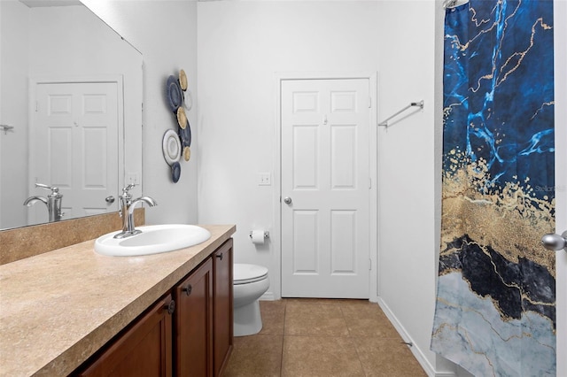 30245 Cheval St, Mount Dora, FL 32757 - full bath featuring vanity, toilet, tile patterned flooring, and baseboards