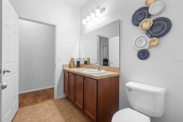 30245 Cheval St, Mount Dora, FL 32757 - bathroom with toilet, vanity, and tile patterned floors
