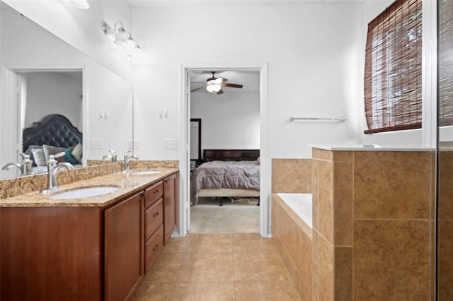 30245 Cheval St, Mount Dora, FL 32757 - bathroom featuring ensuite bathroom, double vanity, tile patterned flooring, and ceiling fan