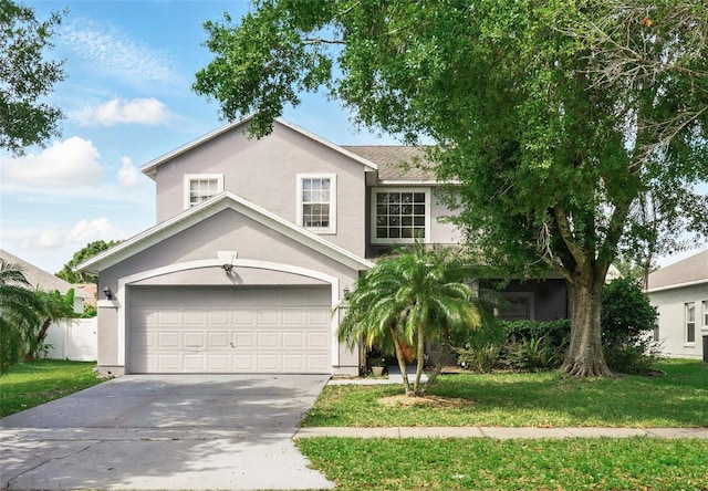 4208 Lugano Ct, Kissimmee, FL 34746 - view of front facade featuring stucco siding, concrete driveway, a front lawn, and a garage