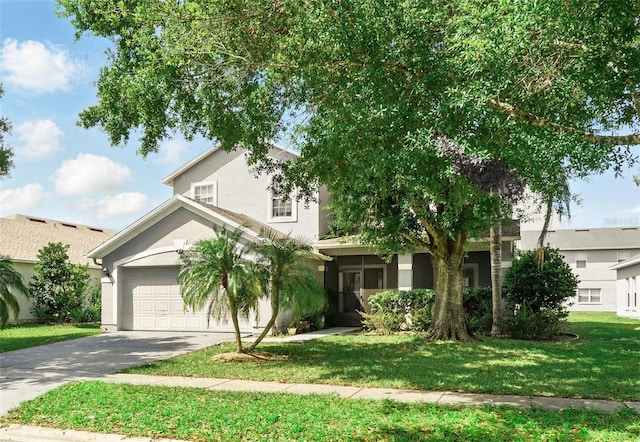 4208 Lugano Ct, Kissimmee, FL 34746 - view of property hidden behind natural elements featuring driveway, stucco siding, a front yard, and an attached garage