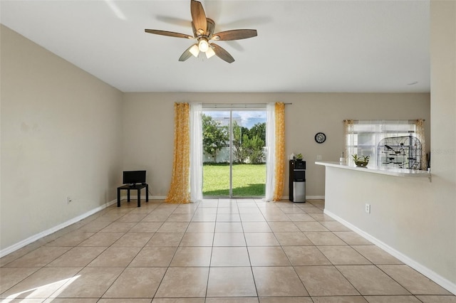 4208 Lugano Ct, Kissimmee, FL 34746 - empty room with ceiling fan, light tile patterned floors, and baseboards