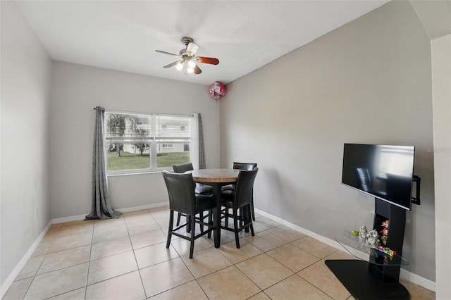 4208 Lugano Ct, Kissimmee, FL 34746 - dining area featuring ceiling fan, light tile patterned floors, and baseboards