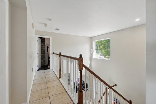 4208 Lugano Ct, Kissimmee, FL 34746 - hall with light tile patterned floors, an upstairs landing, baseboards, and recessed lighting