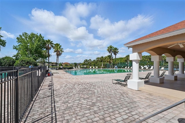 4208 Lugano Ct, Kissimmee, FL 34746 - community pool featuring a patio