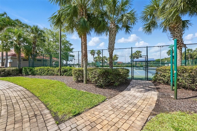 4208 Lugano Ct, Kissimmee, FL 34746 - view of community featuring a gate and a tennis court