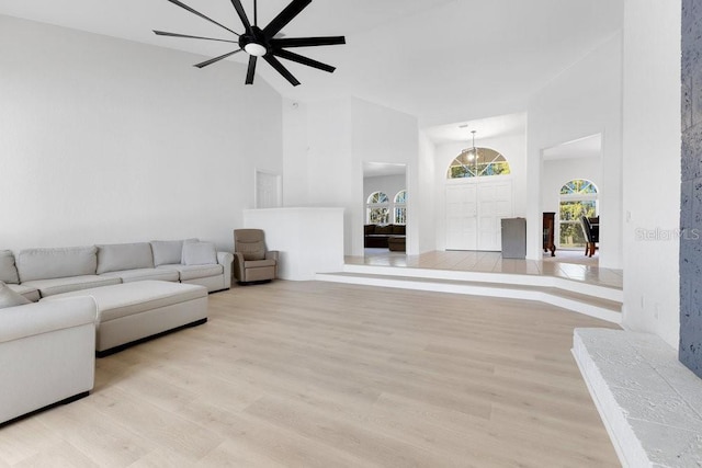 5913 Masters Blvd, Orlando, FL 32819 - living room with a high ceiling, light wood-style floors, and a ceiling fan