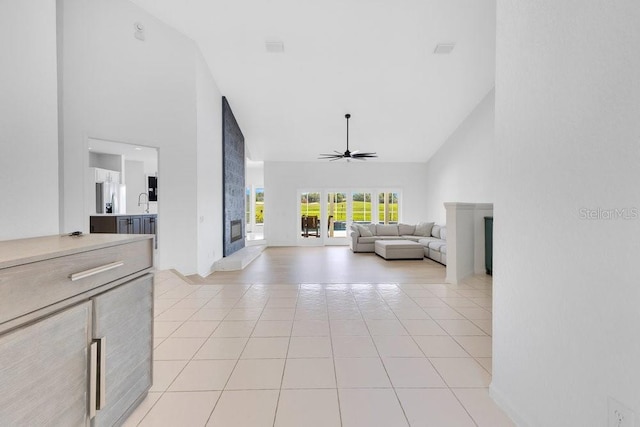 5913 Masters Blvd, Orlando, FL 32819 - living room with high vaulted ceiling, ceiling fan, light tile patterned flooring, and french doors