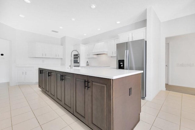 5913 Masters Blvd, Orlando, FL 32819 - kitchen with appliances with stainless steel finishes, white cabinets, light tile patterned flooring, and recessed lighting