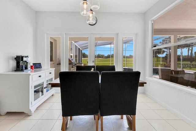 5913 Masters Blvd, Orlando, FL 32819 - dining area with light tile patterned floors and baseboards
