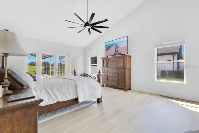 5913 Masters Blvd, Orlando, FL 32819 - bedroom featuring high vaulted ceiling, light wood-style flooring, access to outside, ceiling fan, and baseboards