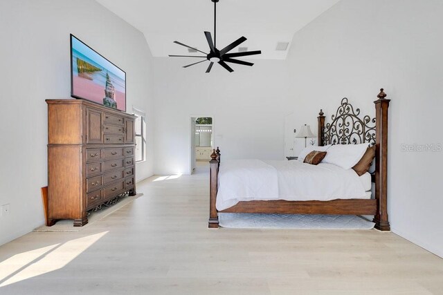 5913 Masters Blvd, Orlando, FL 32819 - bedroom with light wood-type flooring, high vaulted ceiling, and ceiling fan