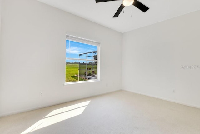 5913 Masters Blvd, Orlando, FL 32819 - carpeted empty room with baseboards and a ceiling fan