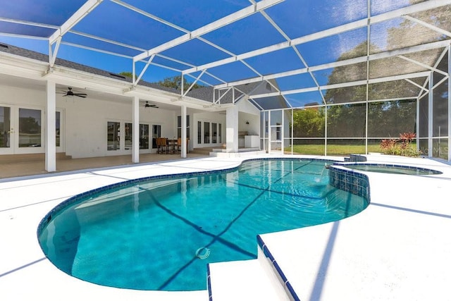 5913 Masters Blvd, Orlando, FL 32819 - view of pool featuring french doors, a patio area, a ceiling fan, a pool with connected hot tub, and glass enclosure