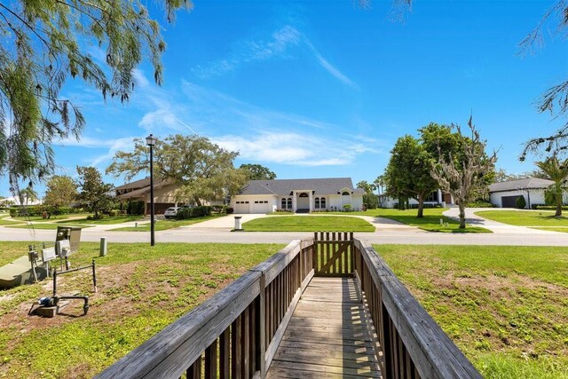 5913 Masters Blvd, Orlando, FL 32819 - view of property's community featuring a lawn
