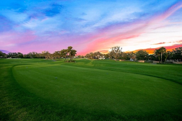 5913 Masters Blvd, Orlando, FL 32819 - view of community with golf course view and a yard