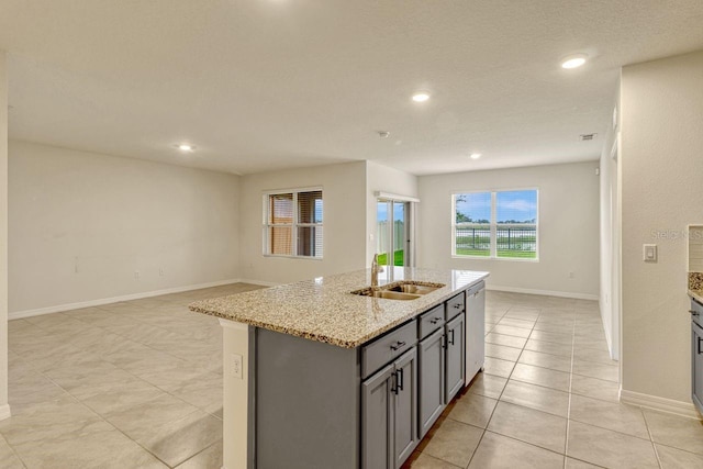 868 Brooklet Dr, Davenport, FL 33837 - kitchen with a sink, gray cabinetry, dishwasher, open floor plan, and a center island with sink