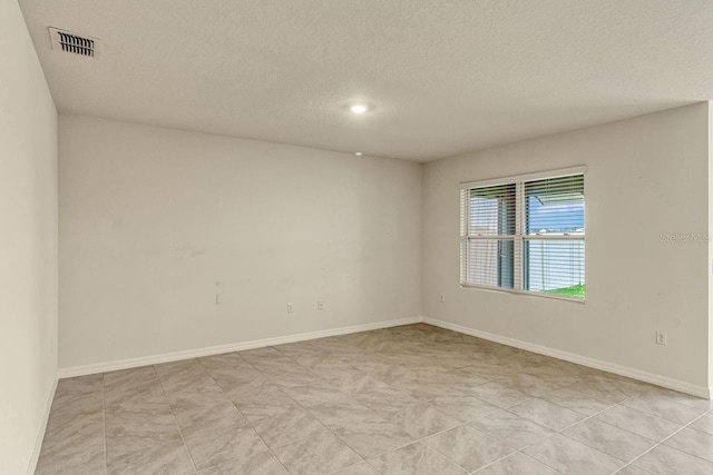 868 Brooklet Dr, Davenport, FL 33837 - unfurnished room featuring a textured ceiling, baseboards, and recessed lighting