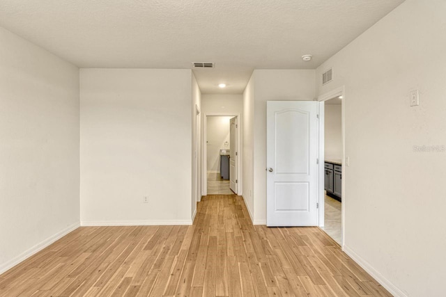 868 Brooklet Dr, Davenport, FL 33837 - unfurnished bedroom with light wood finished floors and baseboards