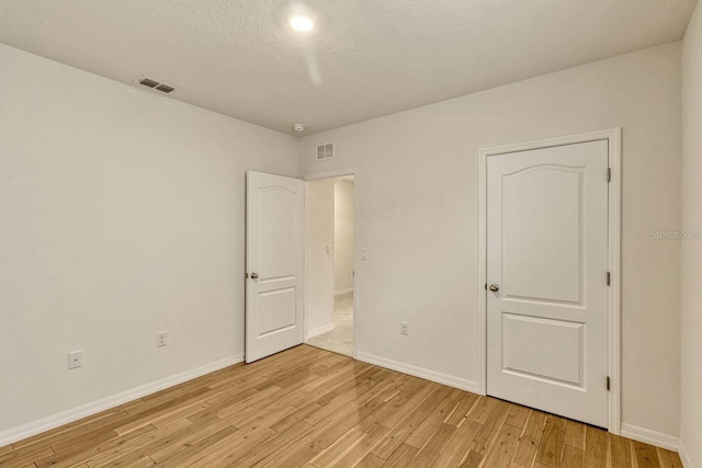 868 Brooklet Dr, Davenport, FL 33837 - unfurnished bedroom featuring light wood finished floors and baseboards