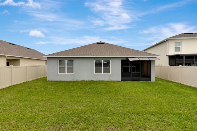 868 Brooklet Dr, Davenport, FL 33837 - rear view of house with a sunroom, stucco siding, and roof with shingles