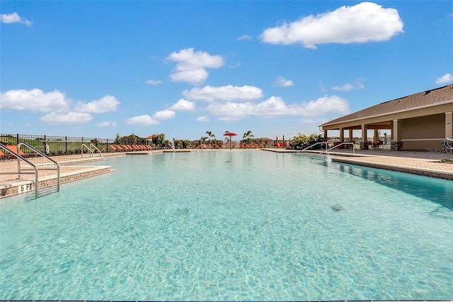868 Brooklet Dr, Davenport, FL 33837 - community pool featuring a patio area