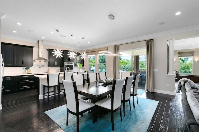 12530 Climbing Vine Ct, Windermere, FL 34786 - dining space featuring recessed lighting, dark wood-type flooring, crown molding, baseboards, and decorative columns