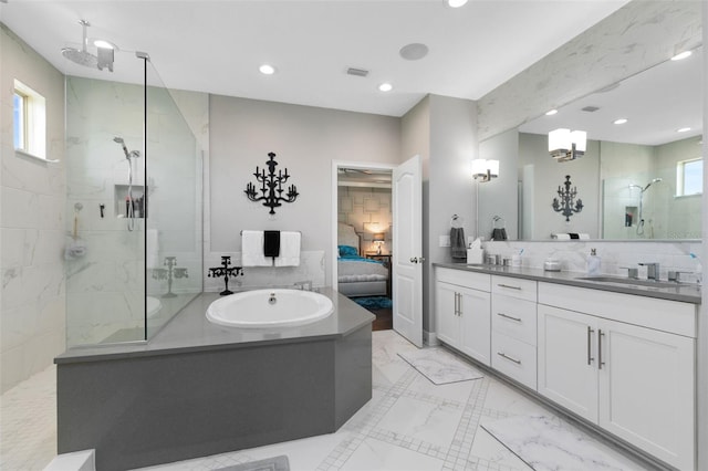 12530 Climbing Vine Ct, Windermere, FL 34786 - ensuite bathroom with tiled shower, double vanity, recessed lighting, and a garden tub