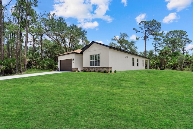 2682 Edwin Ave, North Port, FL 34288 - view of front of house featuring an attached garage, concrete driveway, stone siding, a front yard, and stucco siding
