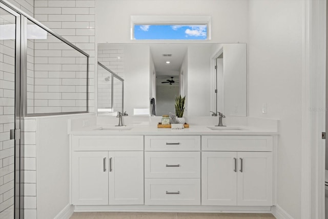 2682 Edwin Ave, North Port, FL 34288 - bathroom with double vanity, ceiling fan, a stall shower, and baseboards