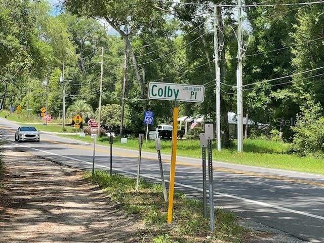 31520 Colby Pl, Sorrento, FL 32776 - view of asphalt road with traffic signs