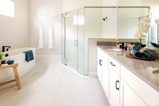 1031 Signet, Apollo Beach, FL 33572 - bathroom featuring a shower stall, a freestanding bath, double vanity, and plenty of natural light