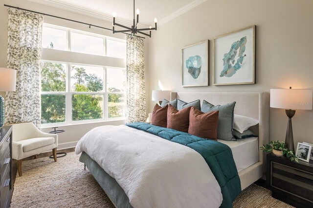 1031 Signet, Apollo Beach, FL 33572 - bedroom with a chandelier, ornamental molding, multiple windows, and wood finished floors