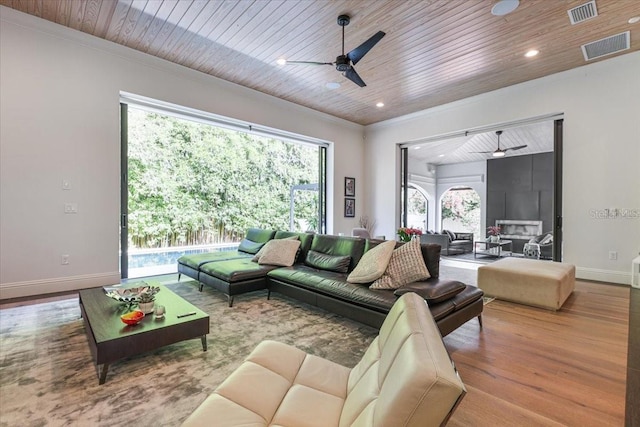 521 S Phelps Ave, Winter Park, FL 32789 - living area with ceiling fan, wooden ceiling, baseboards, wood finished floors, and ornamental molding