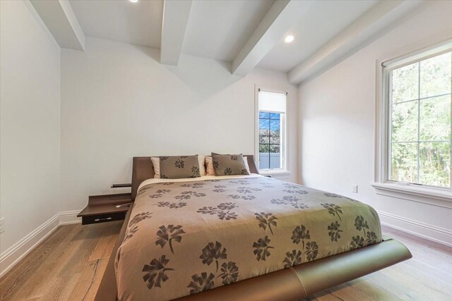521 S Phelps Ave, Winter Park, FL 32789 - bedroom with wood finished floors, beam ceiling, multiple windows, baseboards, and recessed lighting