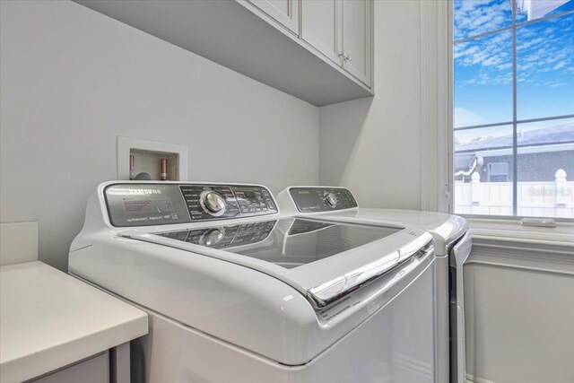 521 S Phelps Ave, Winter Park, FL 32789 - washroom with cabinet space and independent washer and dryer