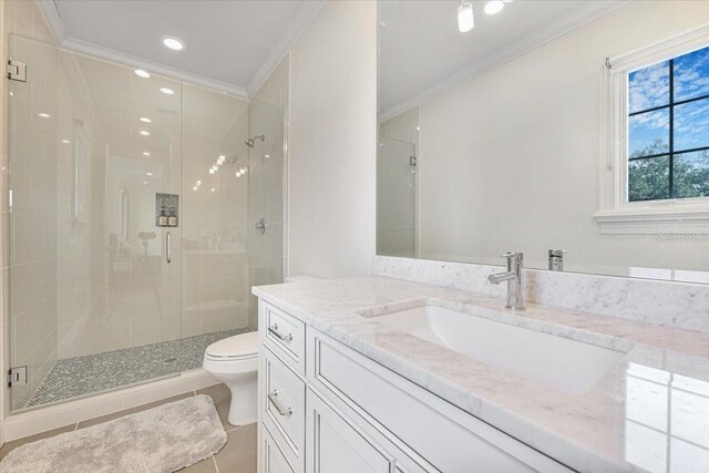 521 S Phelps Ave, Winter Park, FL 32789 - full bath featuring ornamental molding, toilet, a shower stall, vanity, and recessed lighting