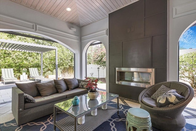 521 S Phelps Ave, Winter Park, FL 32789 - view of patio with an outdoor living space with a fireplace