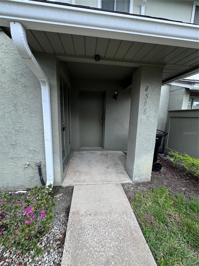 4596 Pheasant Run Dr Unit C, Orlando, FL 32808 - property entrance featuring stucco siding