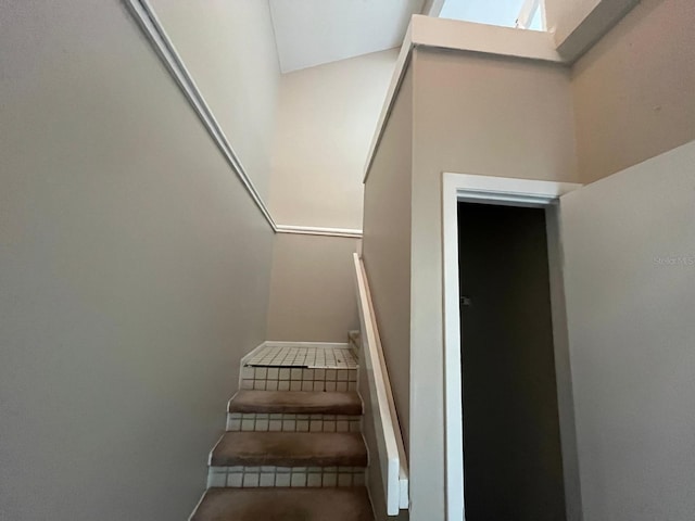 4596 Pheasant Run Dr Unit C, Orlando, FL 32808 - stairway featuring a skylight and carpet flooring