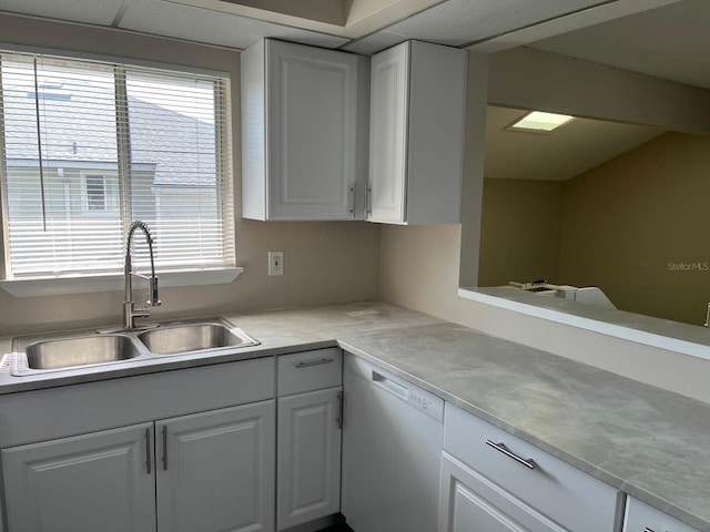 4596 Pheasant Run Dr Unit C, Orlando, FL 32808 - kitchen featuring a sink, white dishwasher, light countertops, and white cabinets