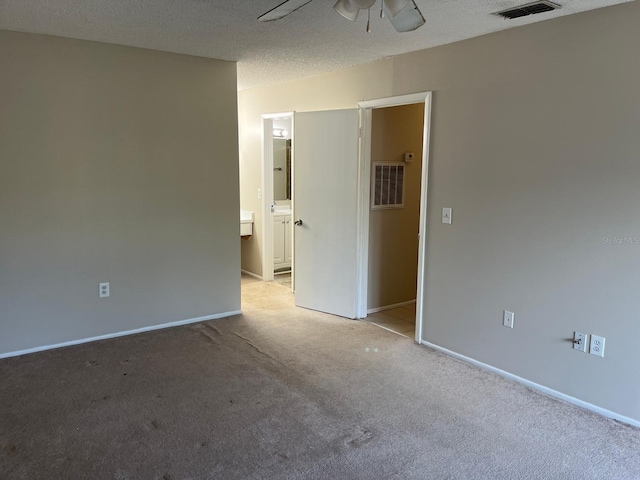 4596 Pheasant Run Dr Unit C, Orlando, FL 32808 - spare room featuring light colored carpet, ceiling fan, baseboards, and a textured ceiling